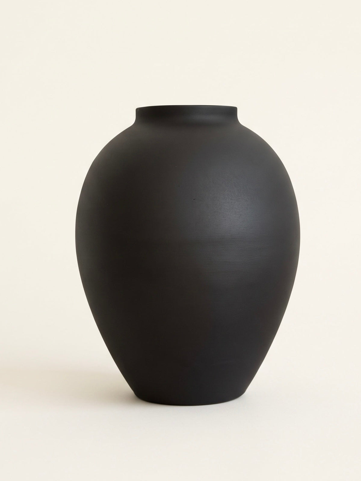 Smooth matte black orb ceramic vase