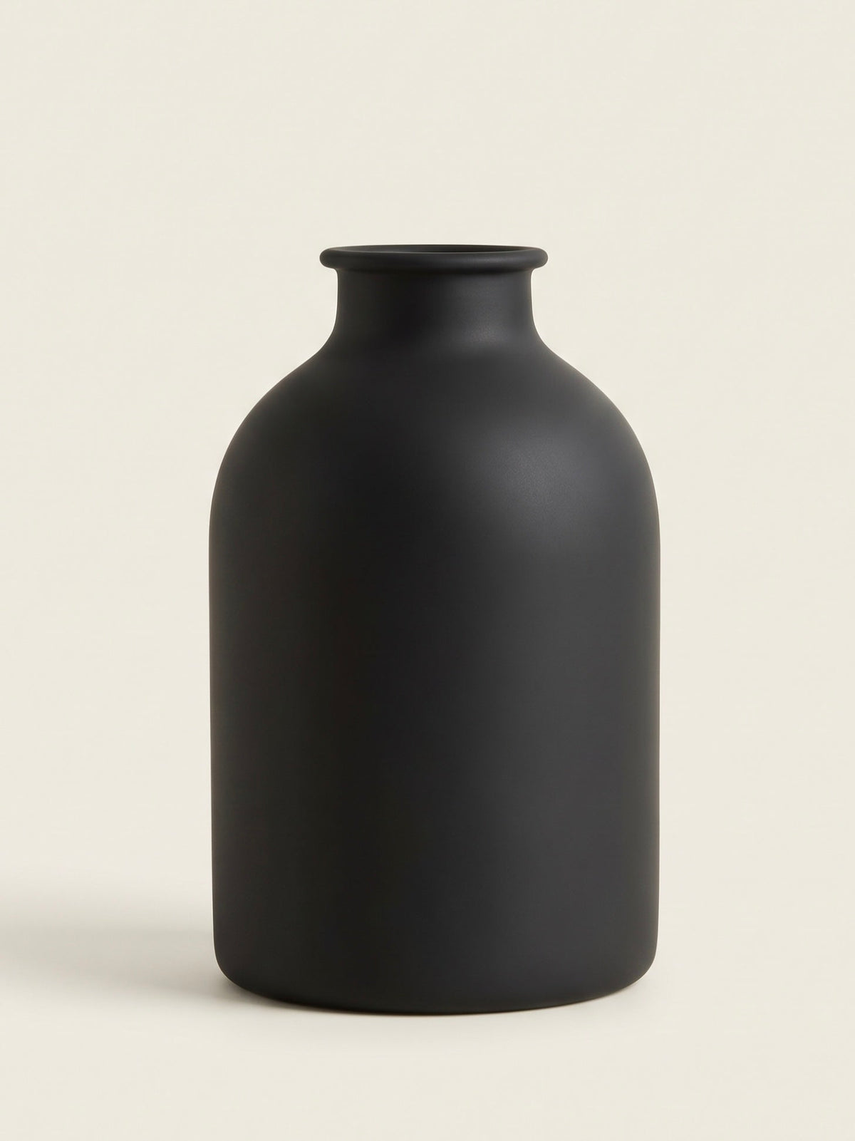 Matte black sculpted carafe ceramic vase
