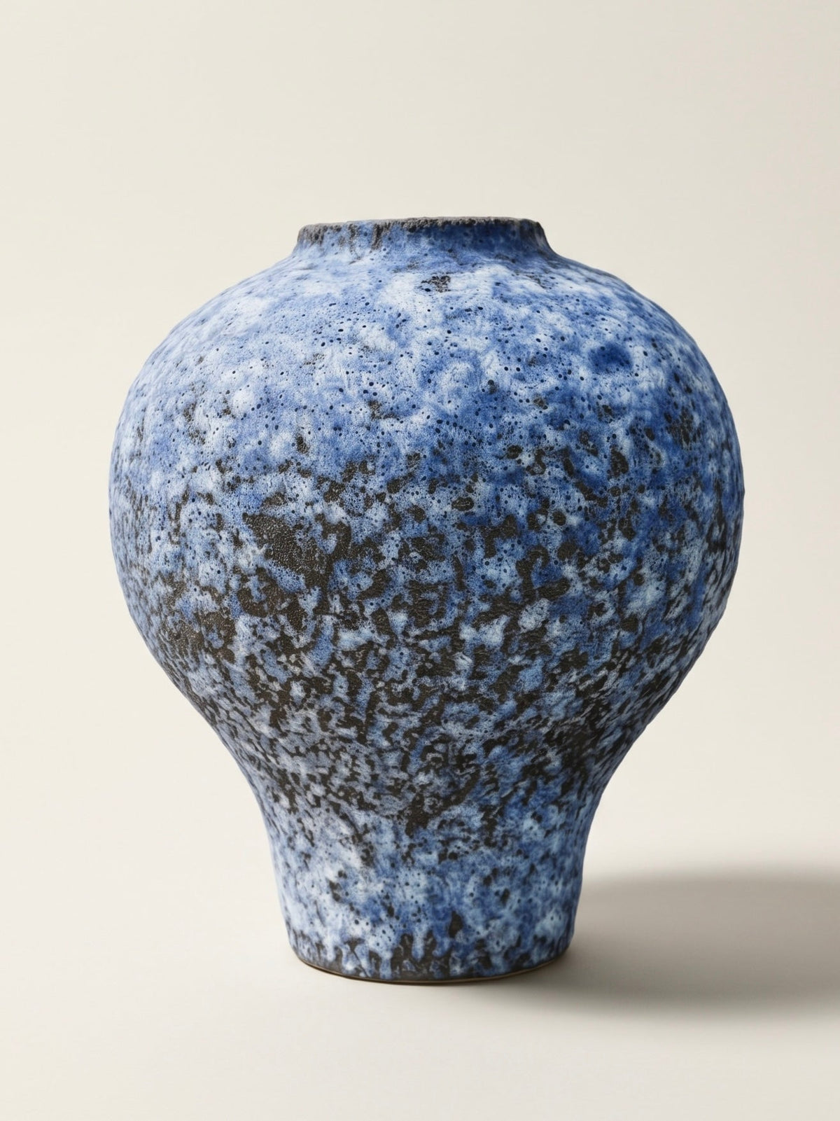 Speckled blue reactive glaze ceramic vase
