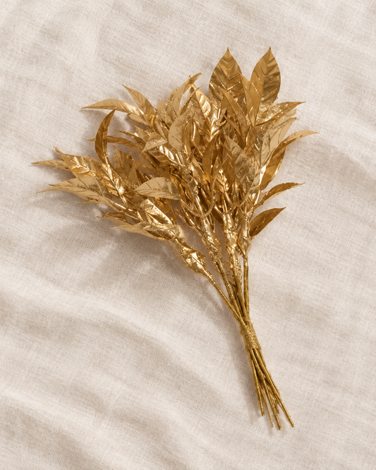 Gold Glitter Artificial Leaf Stems Bunch, shown alone on a linen background