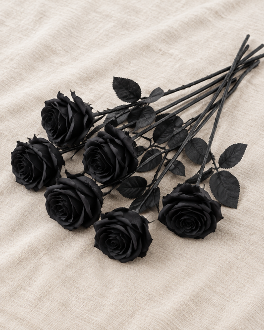 Black Artificial Long-Stem Rose Stems, shown alone on a linen background