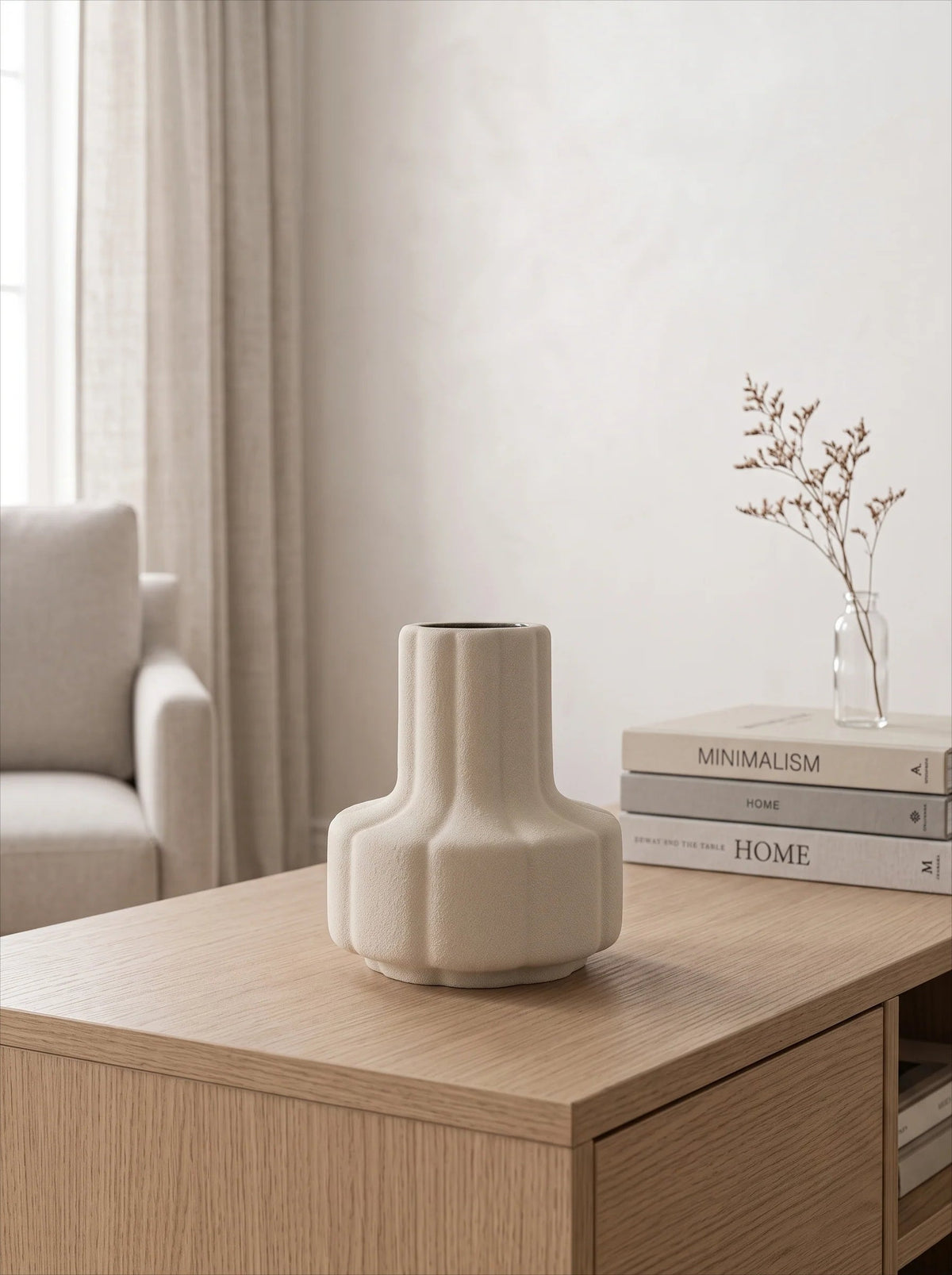 Creamy white ribbed vase in a room