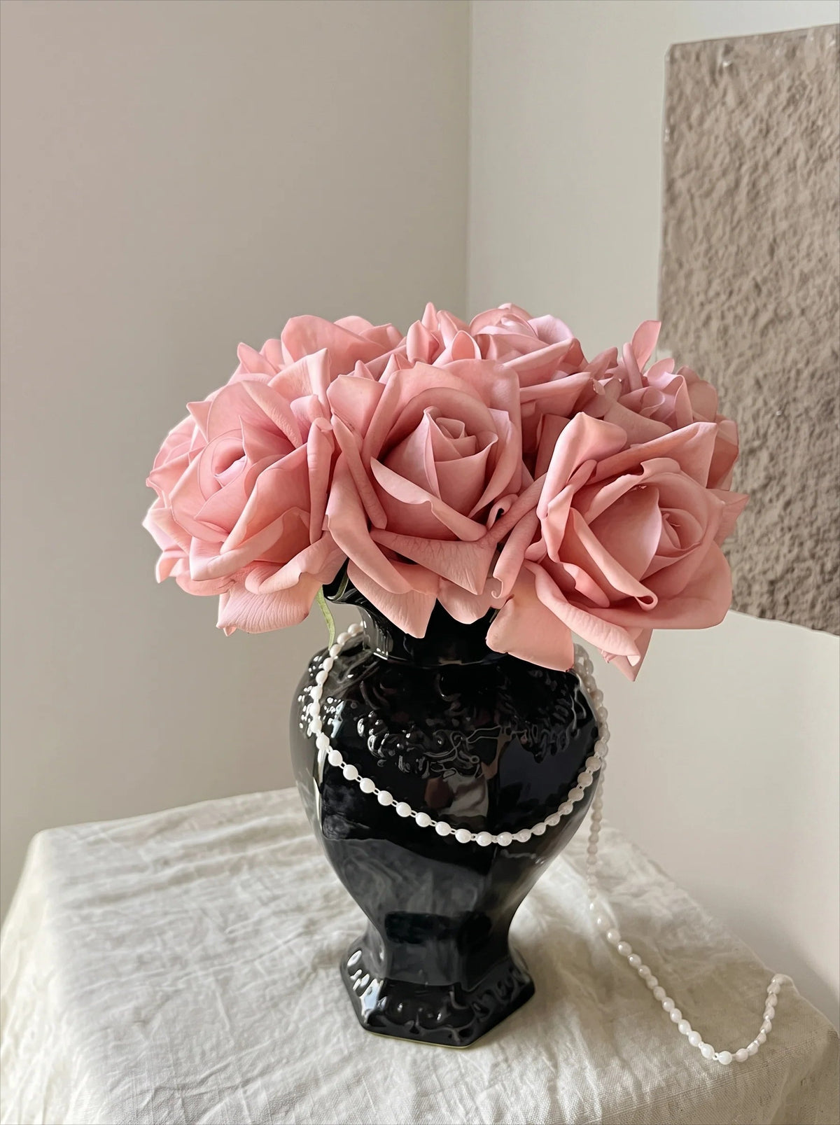 Ruffled black vase side view