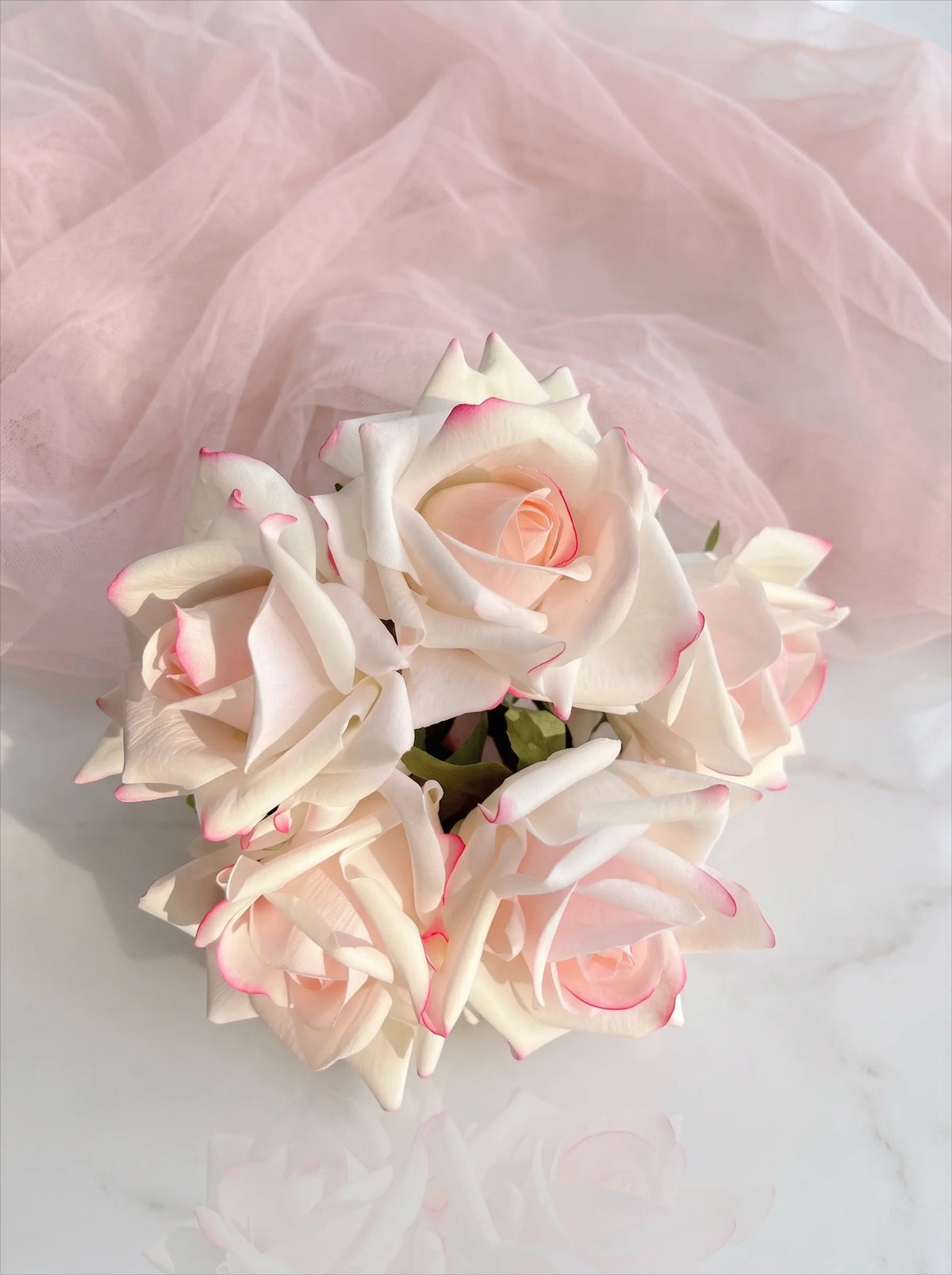 Pink-edged rose bouquet in a vase