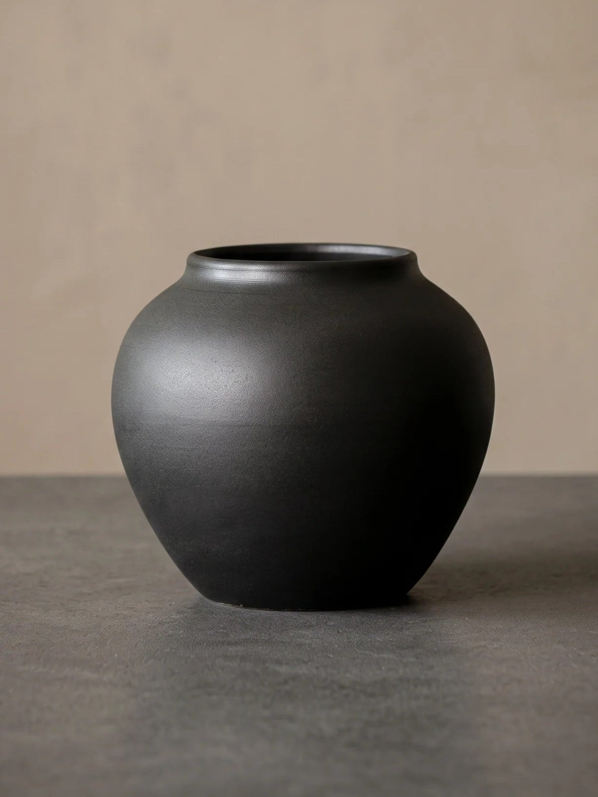 Wabi-sabi black sculptural ceramic vase