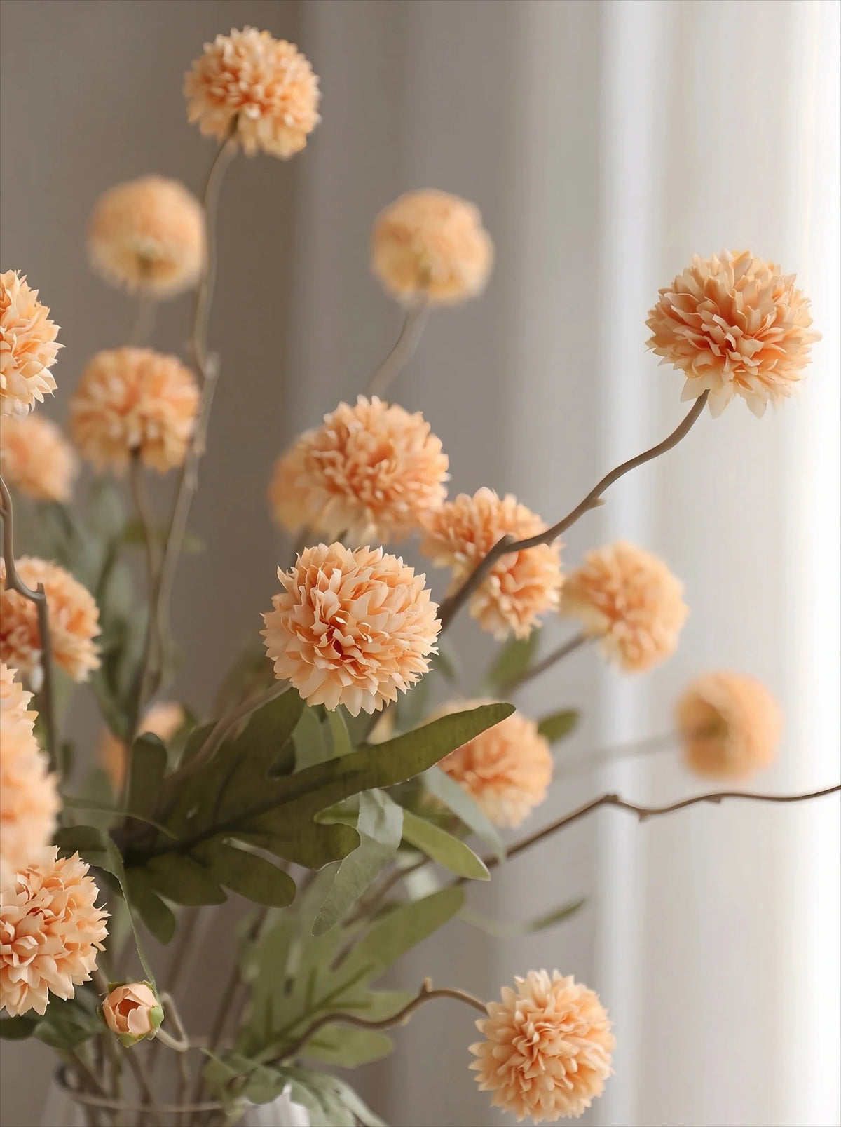 Golden pom-pom arrangement styled