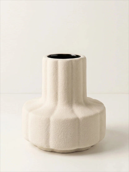 Creamy white ribbed textured ceramic vase