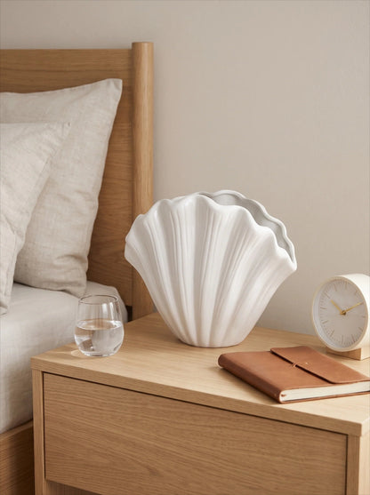 White shell vase with flowers