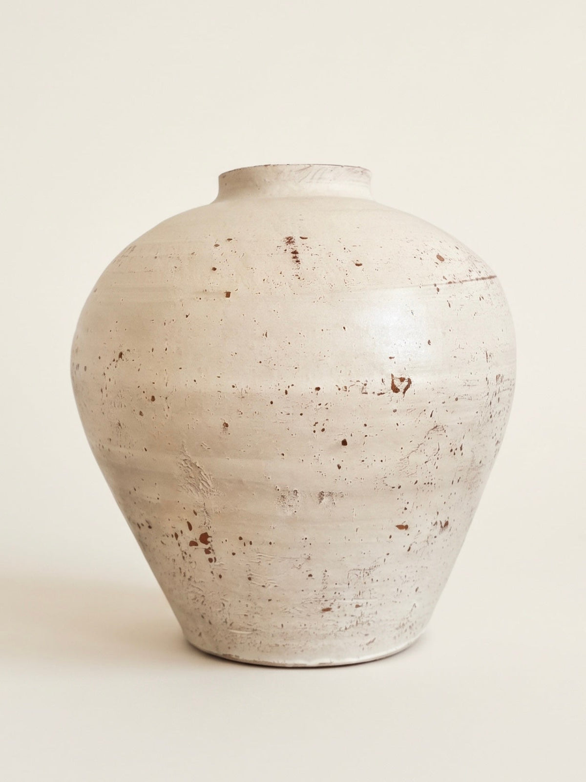 Weathered speckled ivory urn ceramic vase