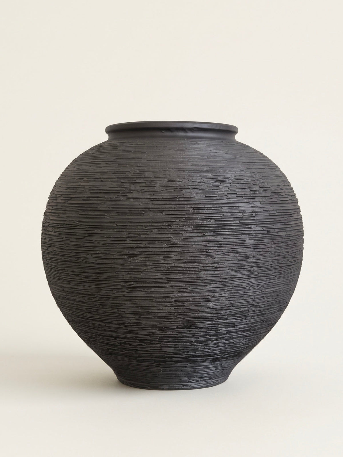 Black linear textured orb ceramic vase