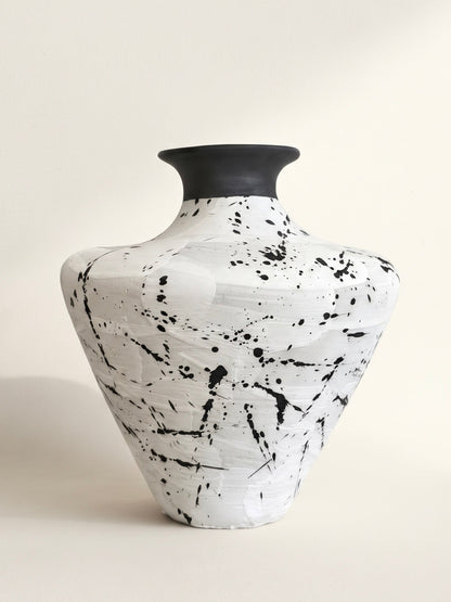 White ceramic vase with black splatter glaze