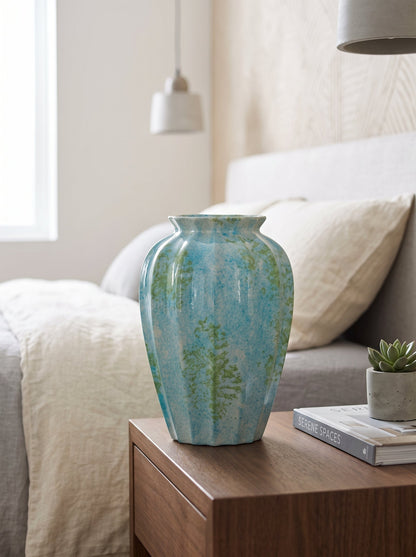 Ocean blue fluted vase on a shelf