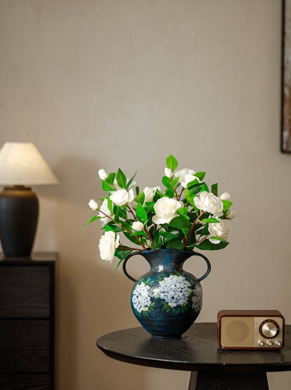 Blue hydrangea vase side view