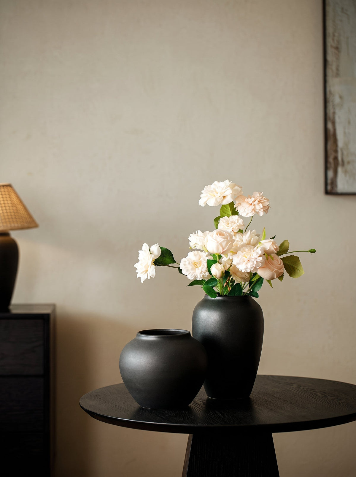 Black sculptural vase styled
