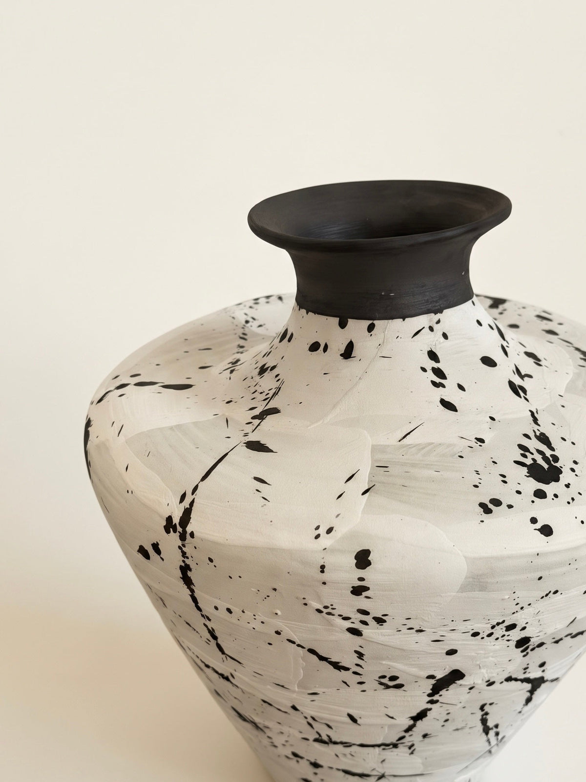 Black splatter white vase styled