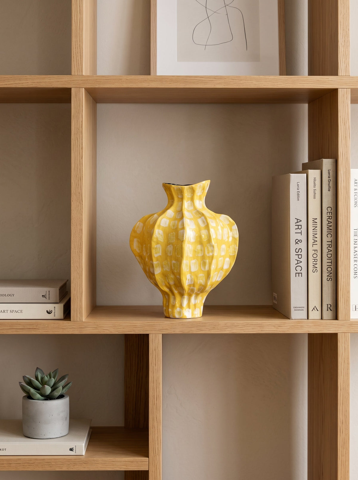 Yellow spotted vase with flowers