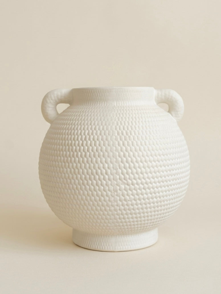 Matte white dimpled ceramic vase with two handles