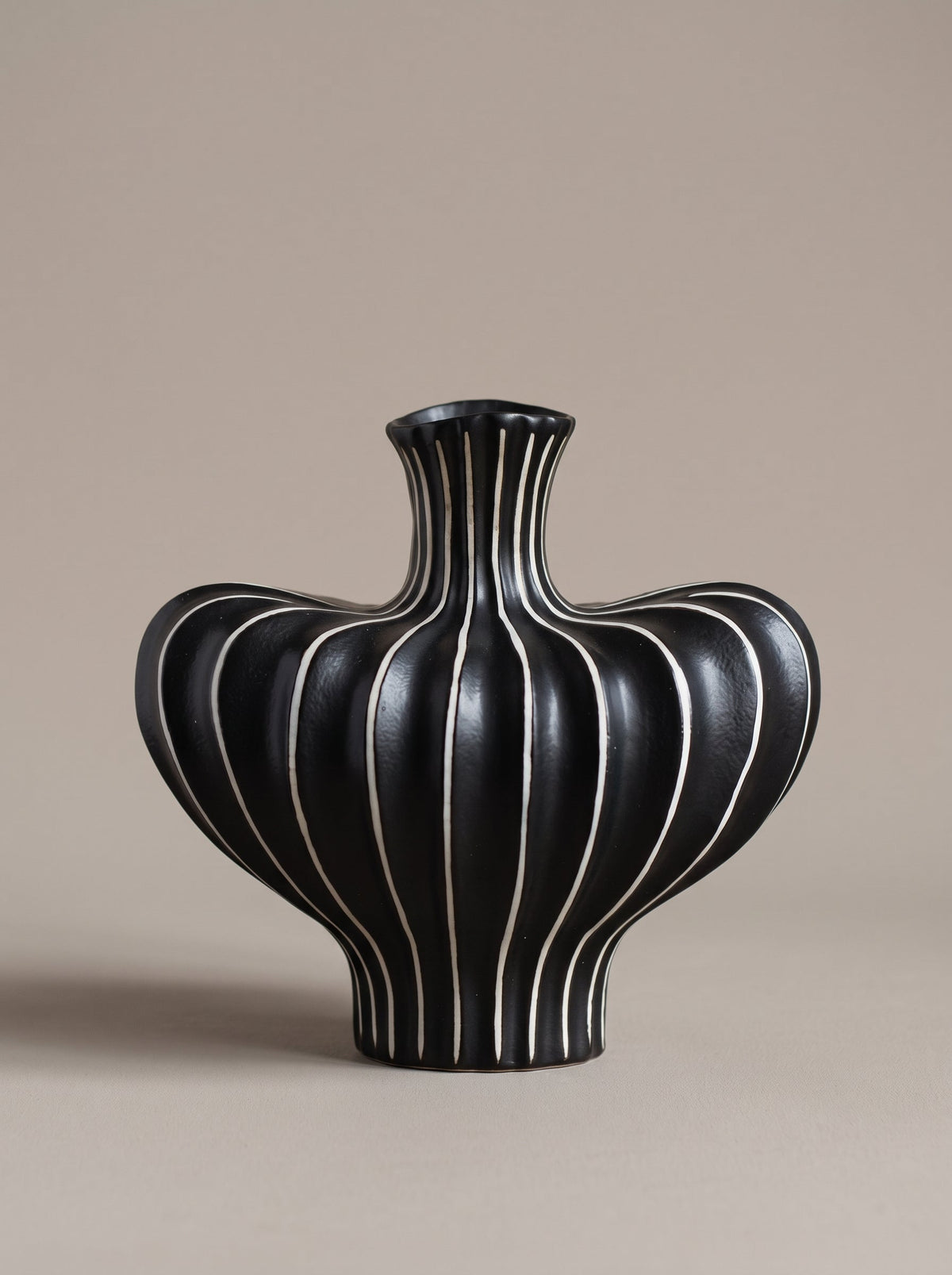 Modern black and white striped sculptural ceramic vase