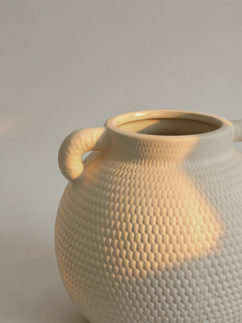 White dimpled vase detail