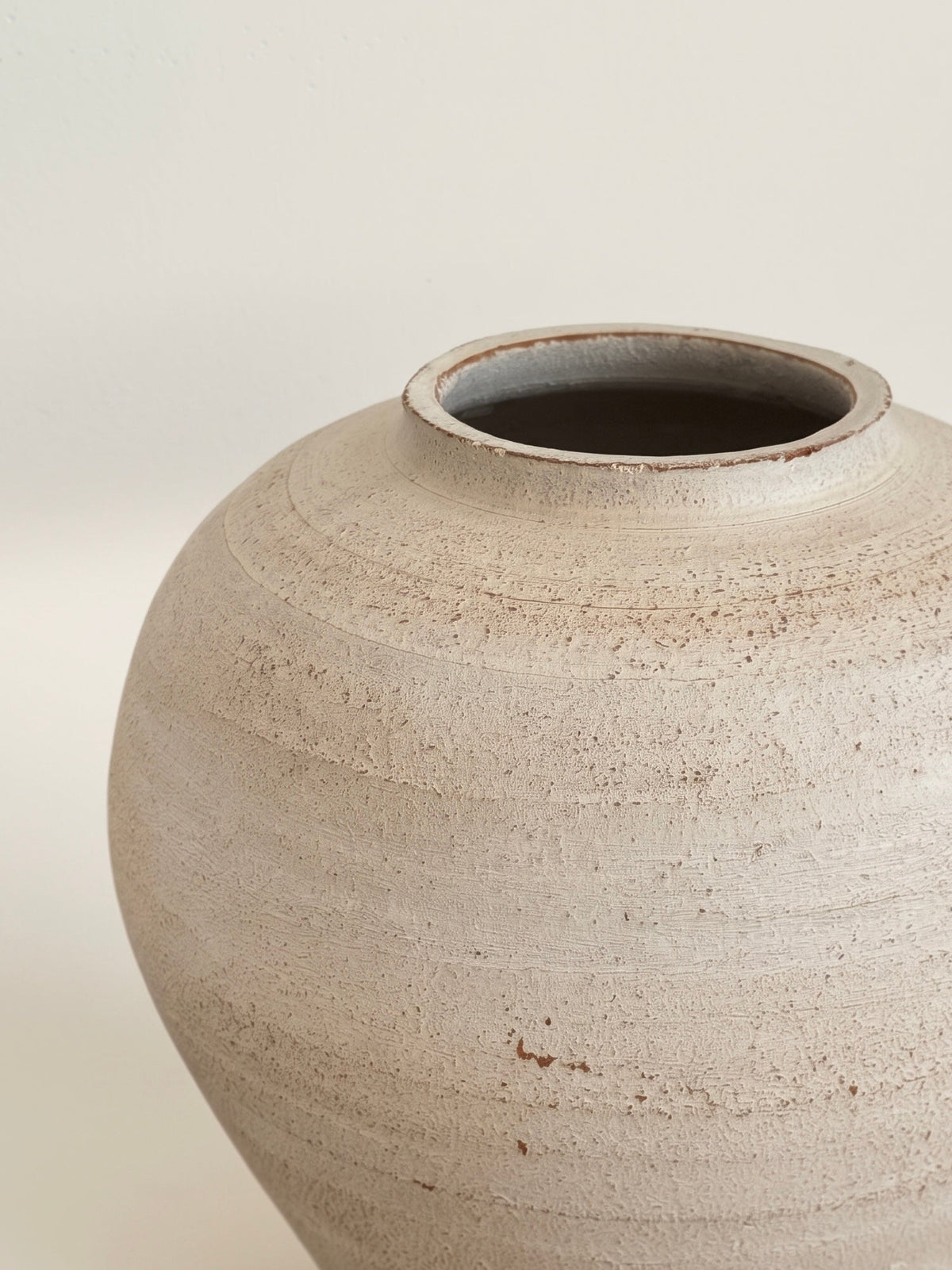 Distressed ivory moon jar vase, side view