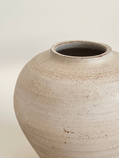 Distressed ivory moon jar vase, side view
