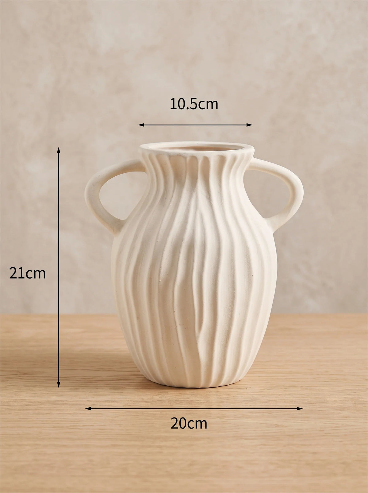 White double-handled vase in a room