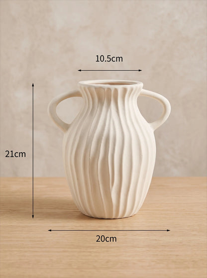 White double-handled vase in a room