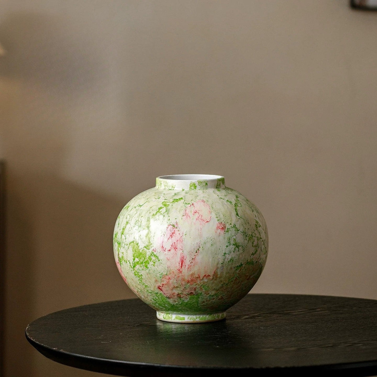 Green splash moon vase on a table