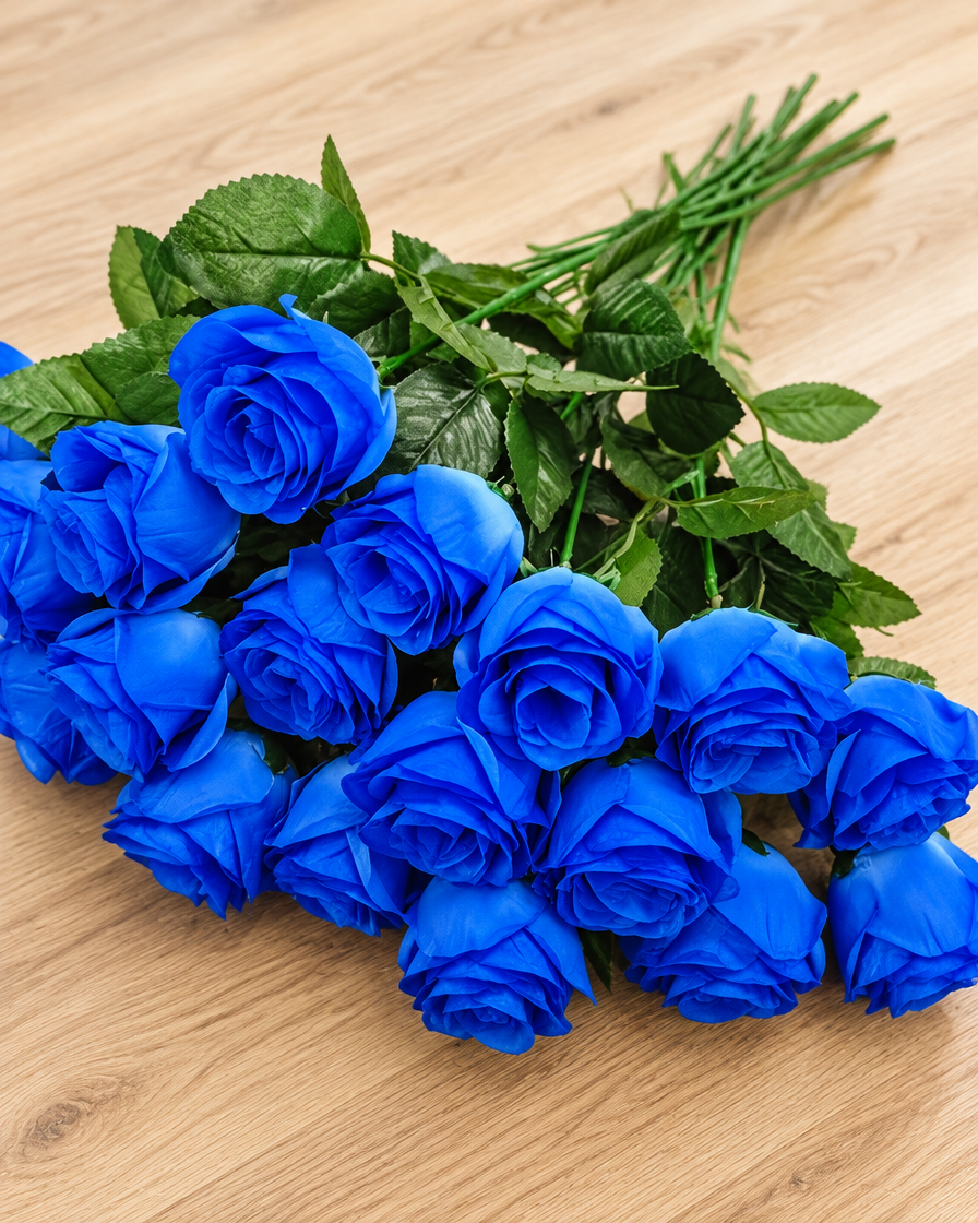 Close-up detail of the royal blue artificial rose bouquet on an oak table