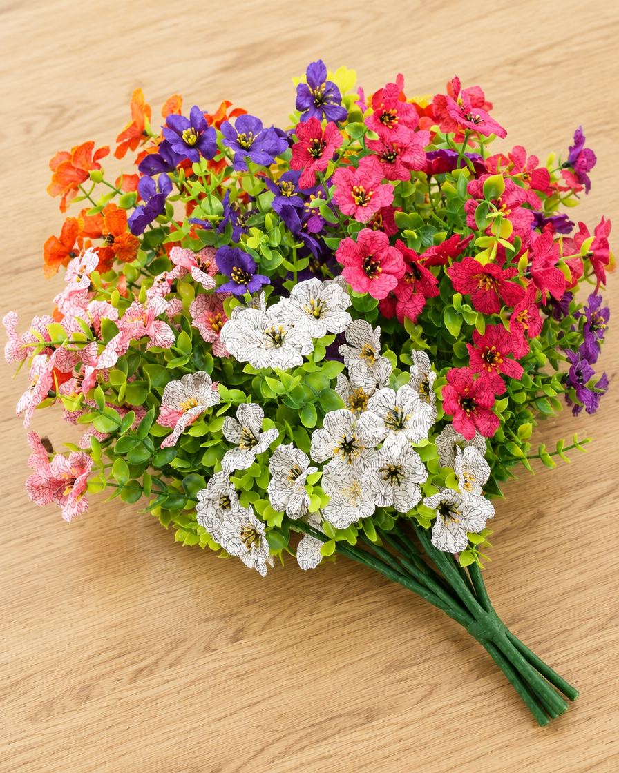 Close-up detail of the colourful artificial wildflower bouquet on an oak table
