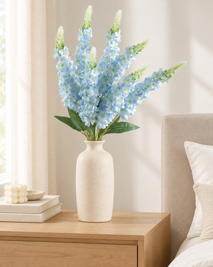 Light Blue Artificial Delphinium Flower Stems styled in a ceramic vase on a dresser (vase sold separately)