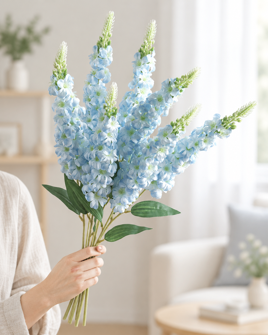 Light Blue Artificial Delphinium Flower Stems held in a hand