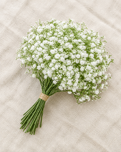 White Artificial Baby's Breath Bunch, shown alone on a linen background