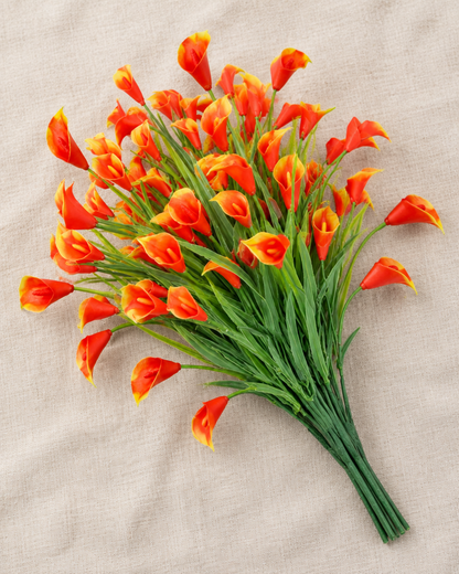 Orange Artificial Calla Lily Bunch, shown alone on a linen background
