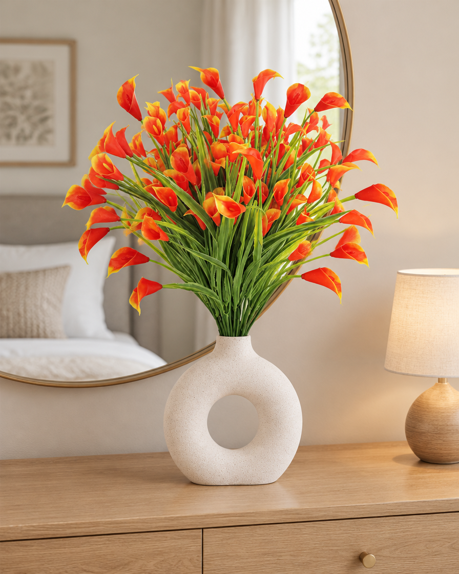 Orange Artificial Calla Lily Bunch styled in a ceramic vase on a dresser (vase sold separately)