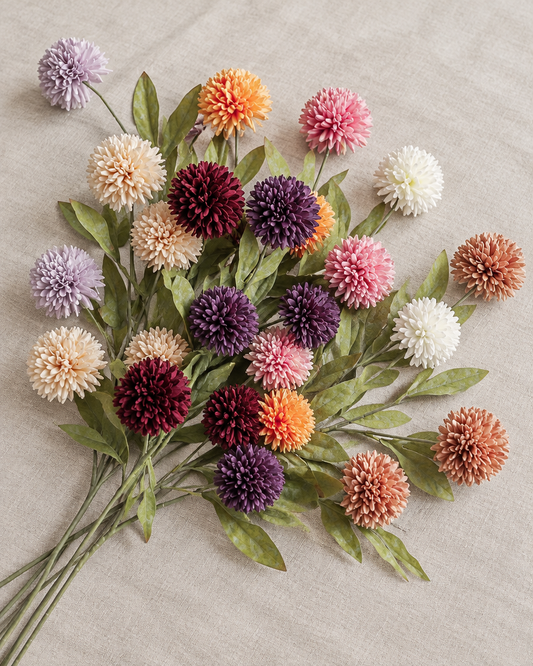Mixed Colour Artificial Dandelion Ball Flower Stems, shown alone on a linen background