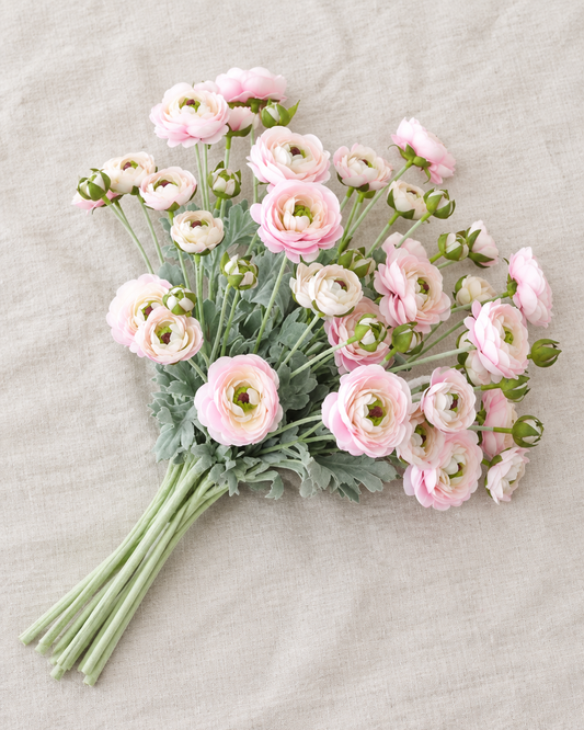 Pale Pink Artificial Ranunculus Stems, shown alone on a linen background