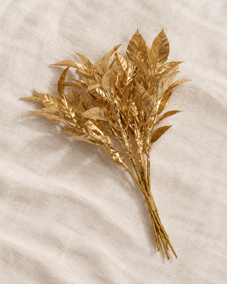 Gold Glitter Artificial Leaf Stems Bunch, shown alone on a linen background