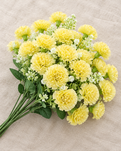 Yellow Artificial Carnation Bouquet, shown alone on a linen background