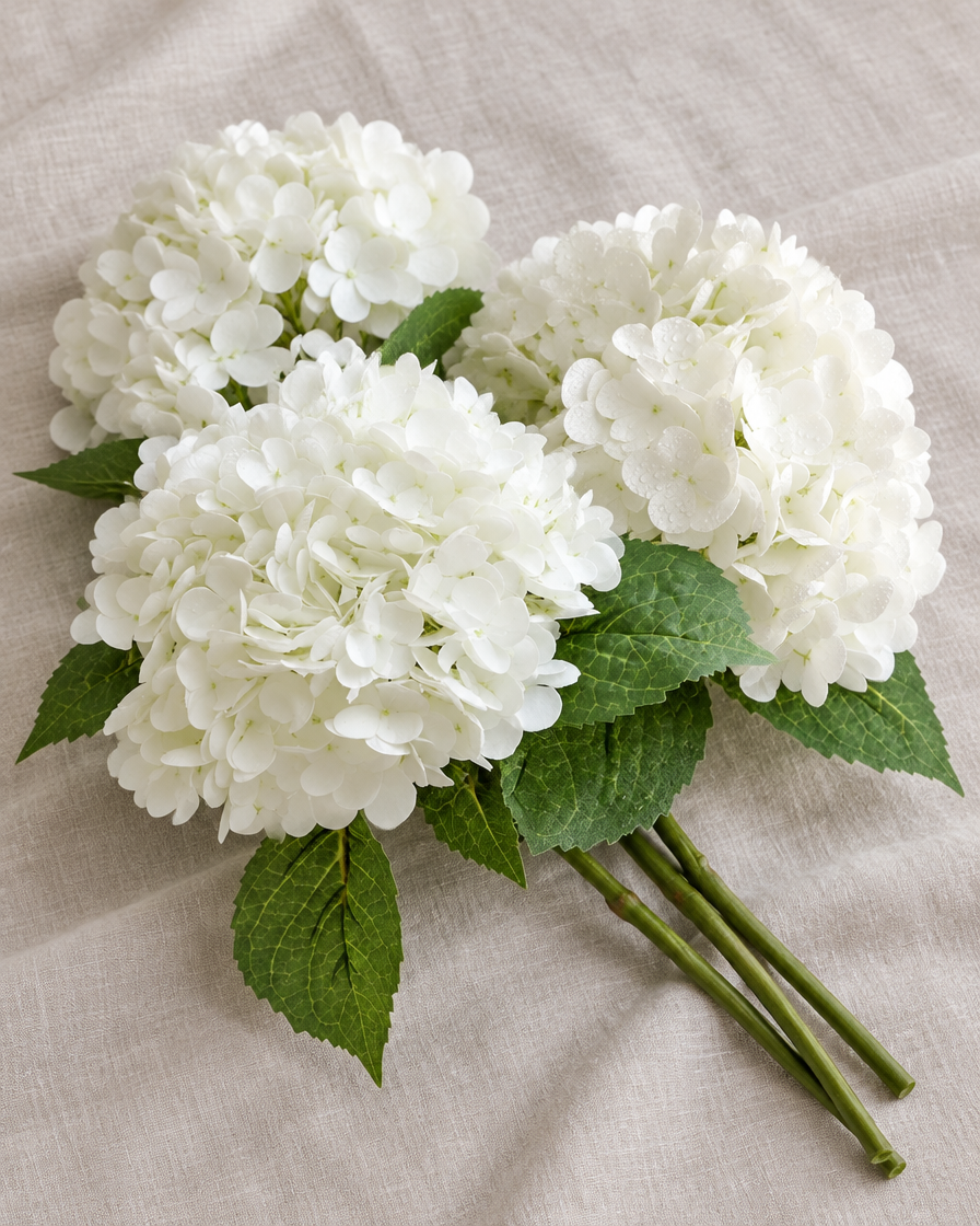 White Artificial Hydrangea Stems, shown alone on a linen background