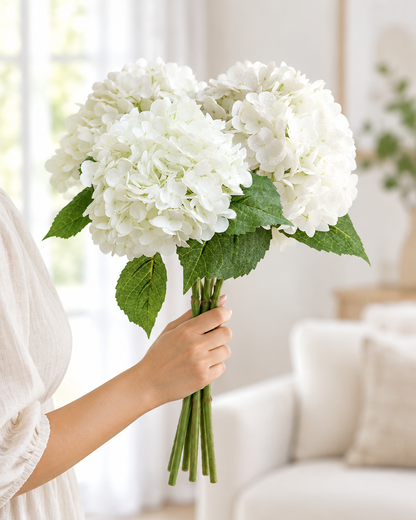 White Artificial Hydrangea Stems held in a hand