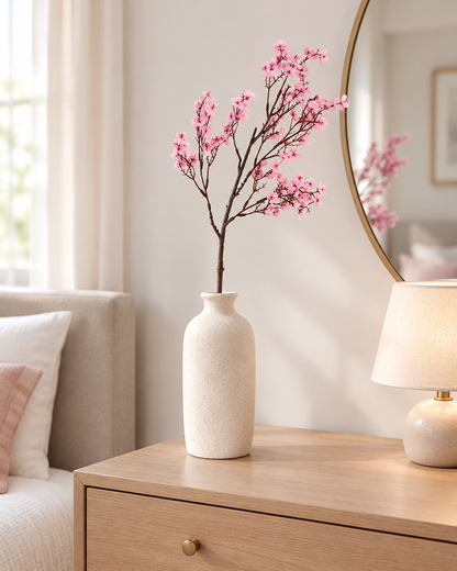 Pink Artificial Blossom Branch styled in a ceramic vase on a dresser (vase sold separately)
