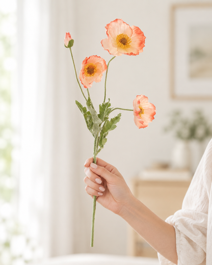 Peach Artificial Poppy Stem held in a hand
