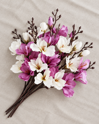 White and Purple Artificial Magnolia Branches, shown alone on a linen background