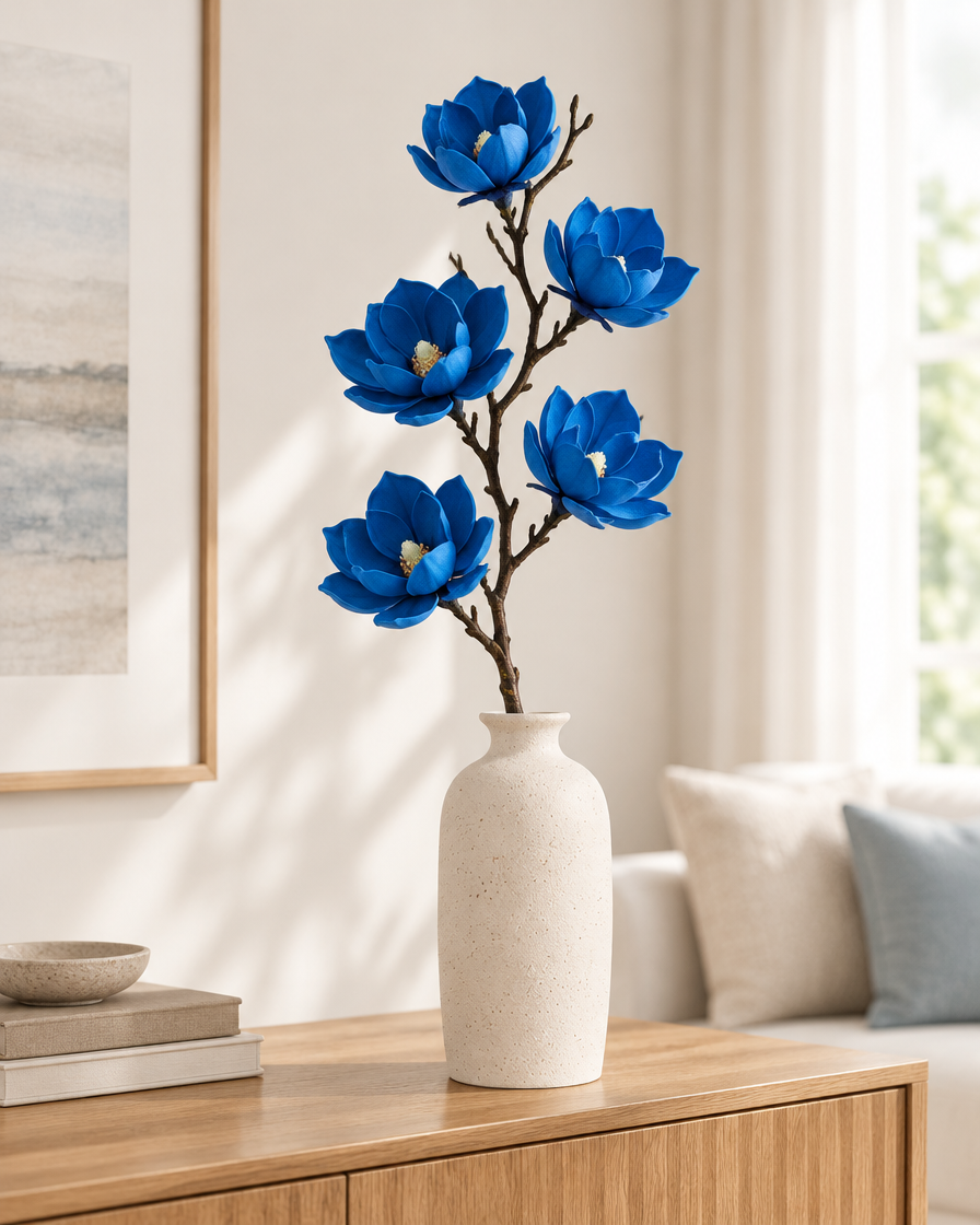 Royal Blue Artificial Magnolia Branch styled in a ceramic vase on a console table (vase sold separately)