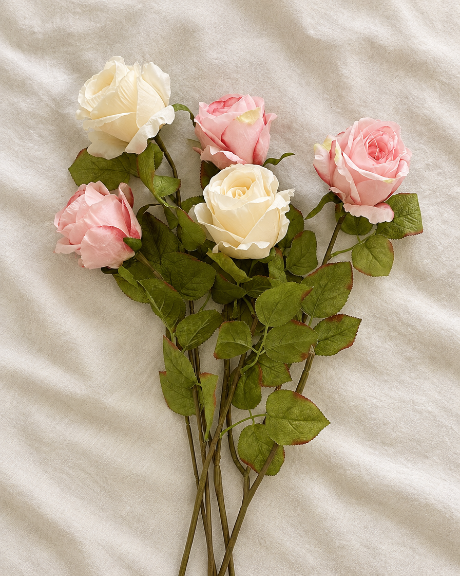 Pink and Cream Artificial Rose Stems, shown alone on a linen background