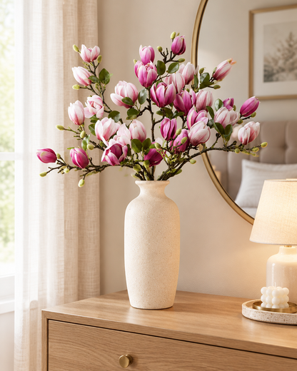 Purple & Pink Artificial Magnolia Branches styled in a ceramic vase on a dresser (vase sold separately)