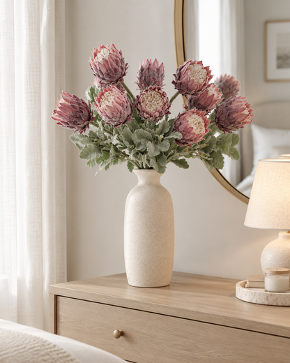 Dusty Pink Artificial Protea Stems styled in a ceramic vase on a dresser (vase sold separately)