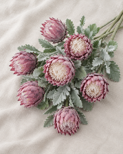 Dusty Pink Artificial Protea Stems, shown alone on a linen background