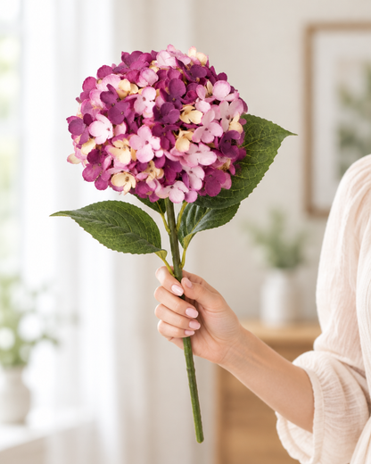 Plum Purple Artificial Hydrangea Stem held in a hand